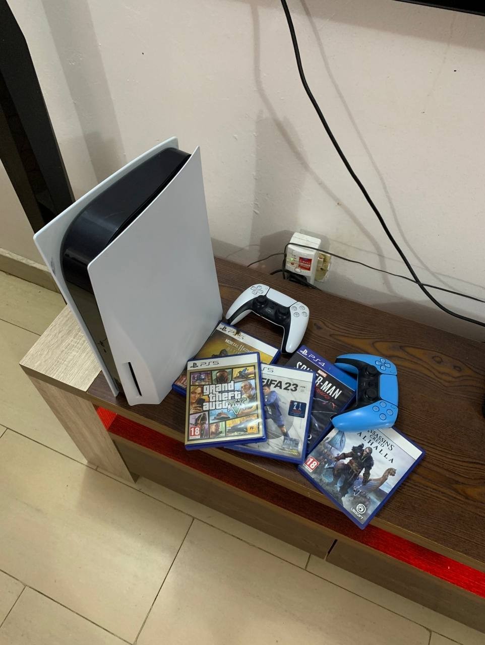 100% Clean PlayStation 5  with 5-disk Games, and 2 working pads